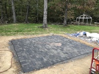 a brick paver is being installed in a backyard